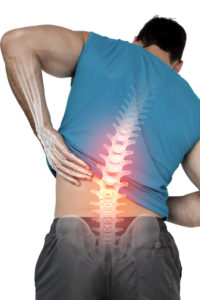 Digital composite of Highlighted back pain of fit man
